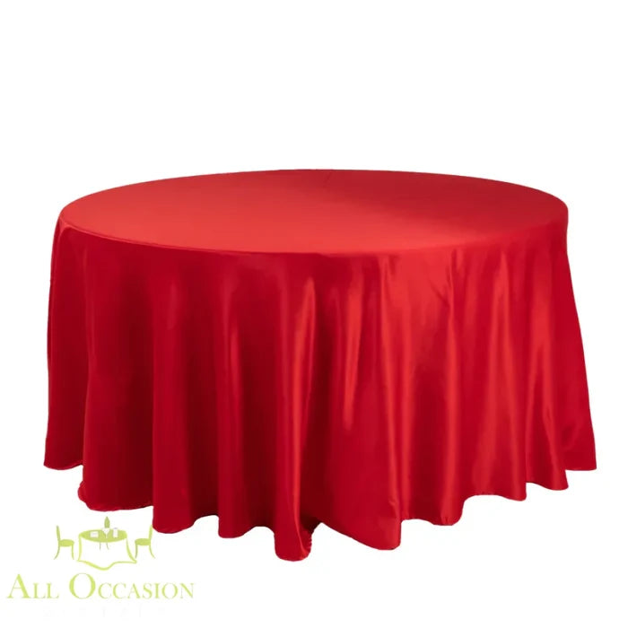 132 Inch Round Polyester Tablecloth Satin Red on a round table, perfect for weddings and elegant events.