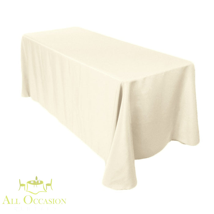 8 ft Polyester Ivory Table Drape rental for elegant weddings and events, showing full coverage over a banquet table.