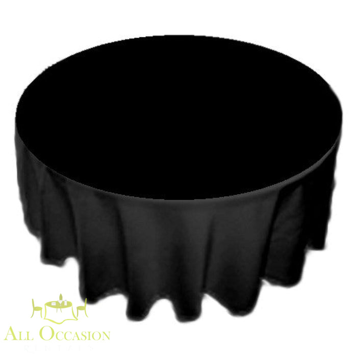 90 inch Round Polyester Tablecloth Black on a round table, perfect for elegant events and celebrations.