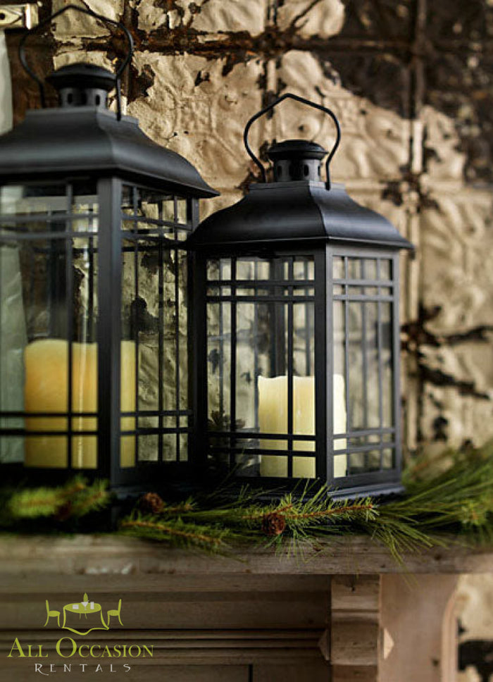 Black metal lanterns medium with candles inside, adding a cozy ambiance to any setting.