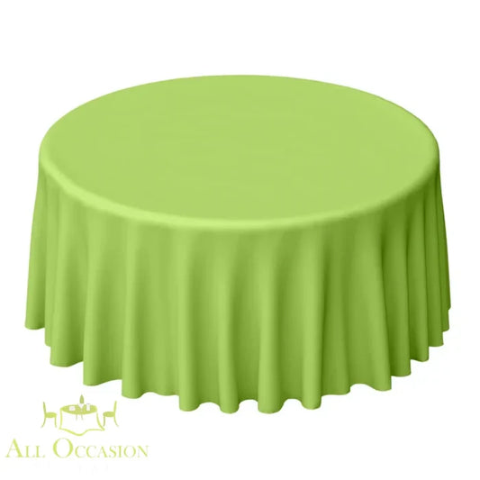 132 Inch Round Polyester Tablecloth Lime Green displayed on a round table, ideal for weddings and special occasions.