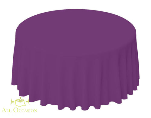 132 Inch Round Polyester Tablecloth Plum on a round table, suitable for upscale events and weddings.