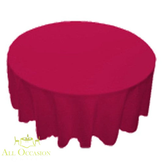 132 Inch Round Polyester Tablecloth Red on a round table, perfect for events and celebrations.
