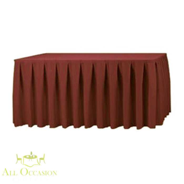 14ft Polyester Table Skirt Burgundy draping elegantly over a banquet table, enhancing event decor.