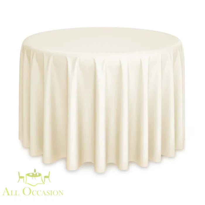 90 inch Round Polyester Tablecloth Ivory draped elegantly over a round table in a soft ivory color.