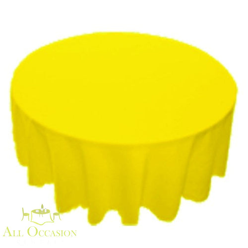 90 inch Round Polyester Tablecloth Lemon on a round table, bright yellow color for festive occasions.