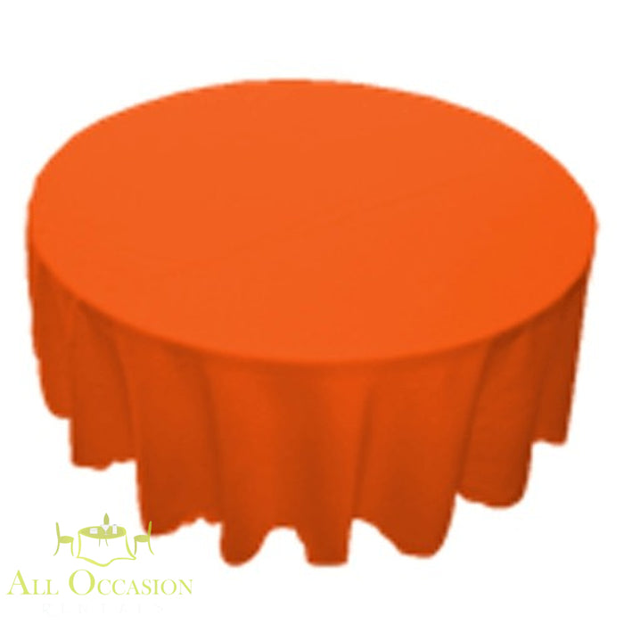 90 inch Round Polyester Tablecloth Orange on a round table, vibrant orange fabric, perfect for events and gatherings.