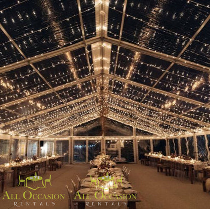 Bistro Lighting Rental 37.5ft white string lights illuminating a beautiful event tent for weddings and outdoor gatherings.
