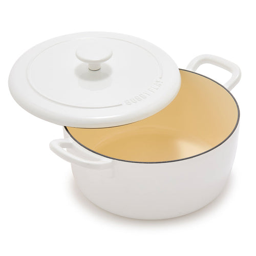 Ivory enameled cast iron Dutch oven with lid, 5.5-quart size, light beige interior.
