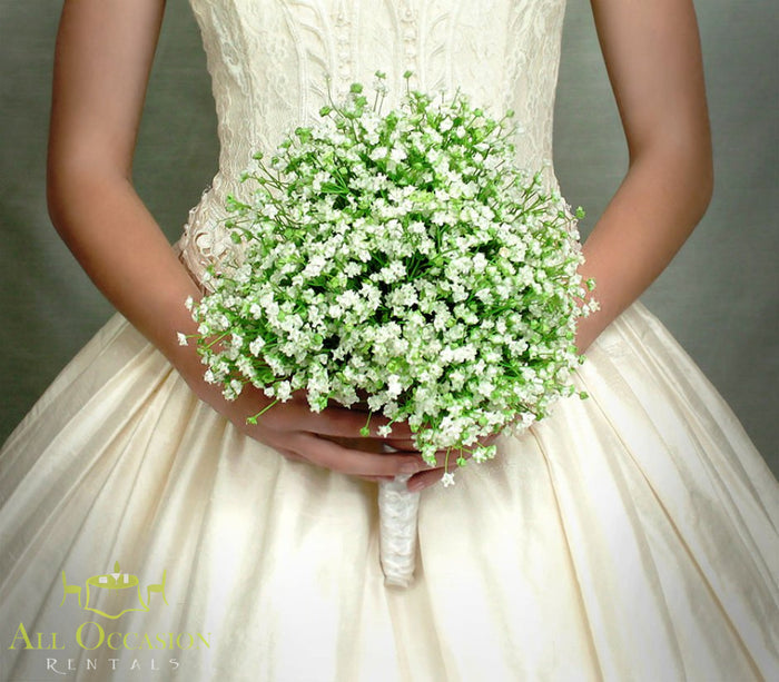 Bridal bouquet of delicate white flowers in a bride's hands, showcasing exquisite Bouquets Flowers for weddings.