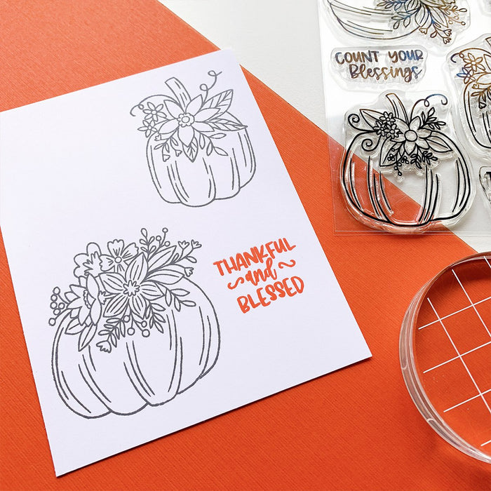 Catherine Pooler - Stamps - Front Porch Pumpkin. If an elegant, farmhouse look is your go-to for Halloween and Fall, then the Front Porch Pumpkins Stamps and Dies are going to be a fav!  These beautiful line art pumpkins are adorned with a variety of flowers and greenery and are ready for Pinterest perfect cards! Available at Embellish Away located in Bowmanville Ontario Canada - Stamped image example