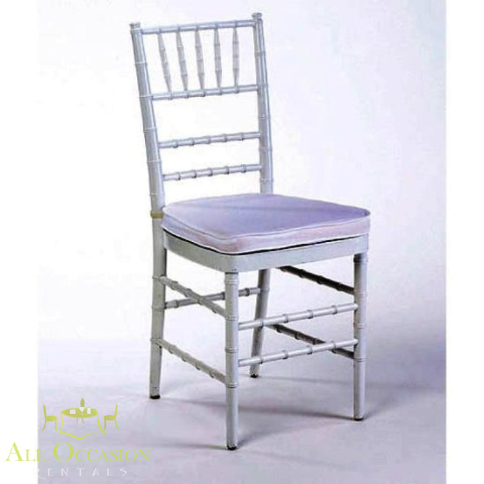 Chiavari chair in silver with white cushion, ideal for weddings and events. Available through Corona event rentals.