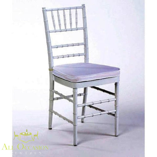 Chiavari chair in silver with white cushion, ideal for weddings and events. Available through Corona event rentals.