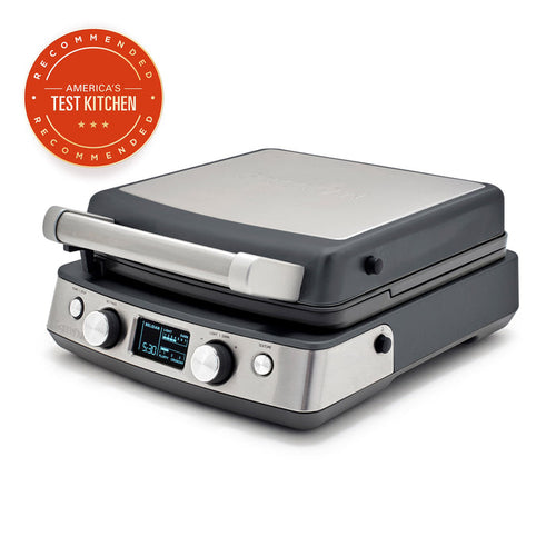 Graphite ceramic 4-square waffle maker shown next to an Americas Test Kitchen badge.