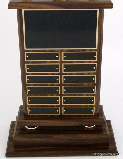 Perpetual trophy, showing front of the base. Displays a large black laser-engraved heading plate, accompanied by 12 smaller individual plates for recording past winners