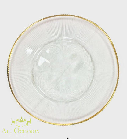 Glass Charger Plate with Gold Rim Rental featuring clear glass with a decorative gold rim for elegant events.