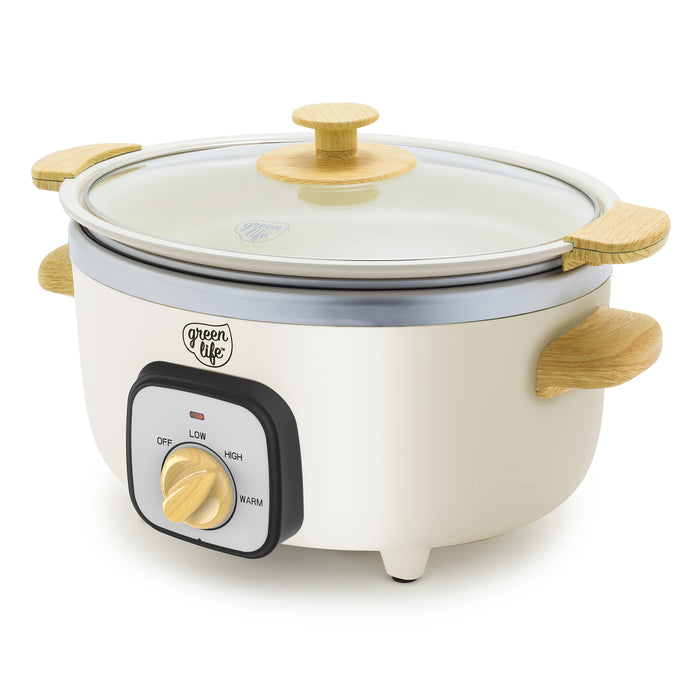 Cream slow cooker with wood-print handles and a glass lid on a white background