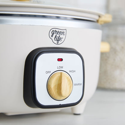 Cream slow cooker with a control panel and knob