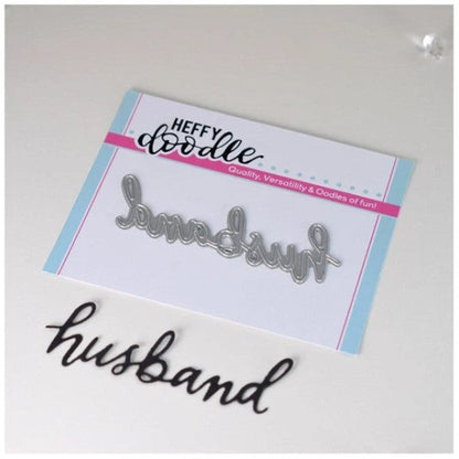 Heffy Doodle - Heffy Cuts Die - Husband. A standalone metal cutting die of the word ‘Husband’ in a hand lettered style. Measuring approximately 3" x 1". Available at Embellish Away located in Bowmanville Ontario Canada.