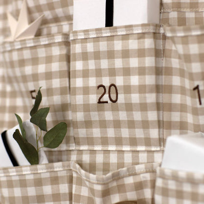 Plaid advent calendar with numbers and small plants