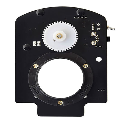 OPTIKinetics 50mm Variable Speed Active Gate Cassette Rotator close-up view showing the gear-driven cassette mount, speed dial, and direction toggle switch controls