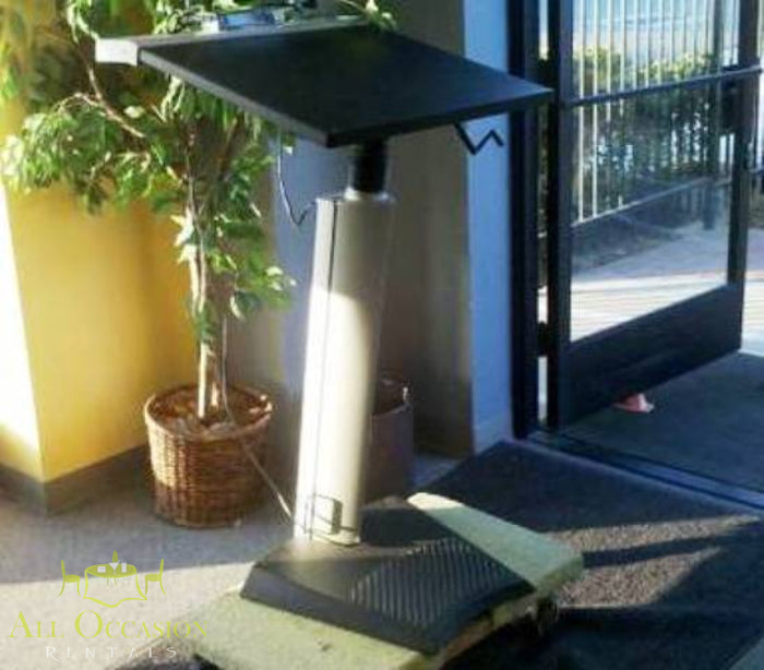 Podium Rental stainless steel with black top positioned in a professional setting for events and speeches.
