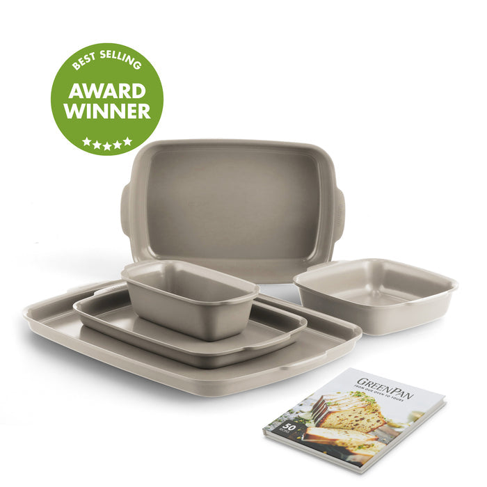 Taupe ceramic nonstick bakeware set, five pieces, shown with lasagna pan, cookbook, and a green award badge.