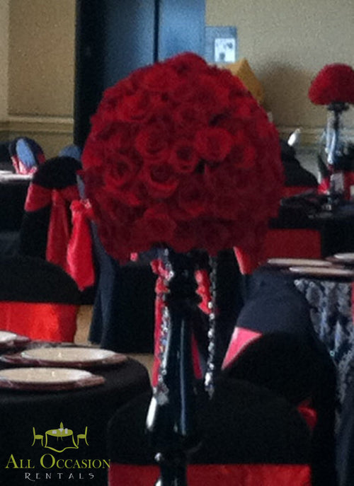 Red Rose Pedestal Centerpiece Rental featuring a luxurious red rose arrangement on a black pedestal with crystal accents.