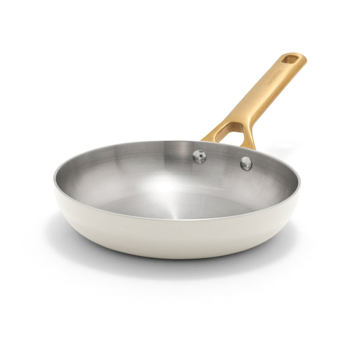 Cream stainless steel 8-inch frypan with a gold handle, shown on a white background.