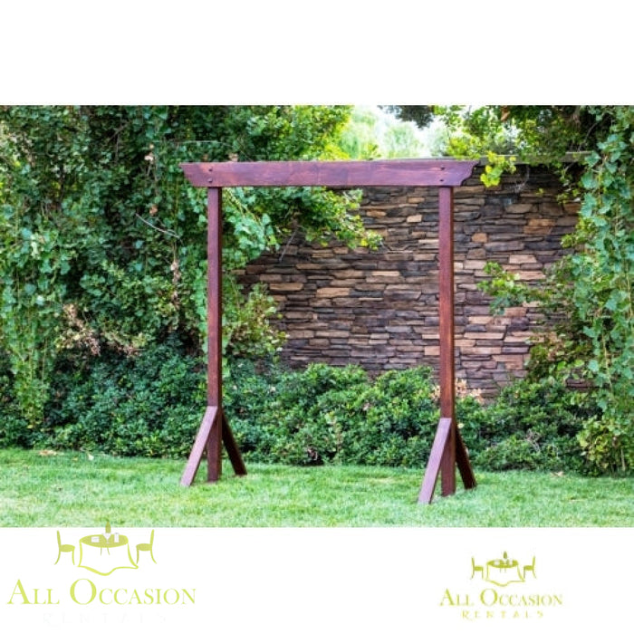 Rustic wood wedding arch rental for special events in Corona. Ideal for wedding ceremonies or outdoor decorations.