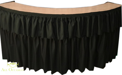 Serpentine Bar with Black Draping rental featuring a sleek curved design and elegant black draping for events.