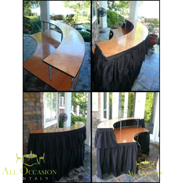 Serpentine Bar with Black Draping rental showing curved design and stylish black draping for events.