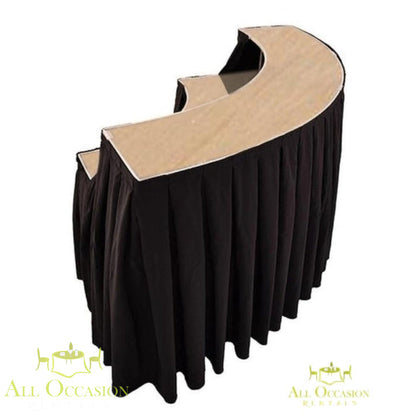 Serpentine Bar with Black Draping rental featuring a sleek curved design for elegant event setups.