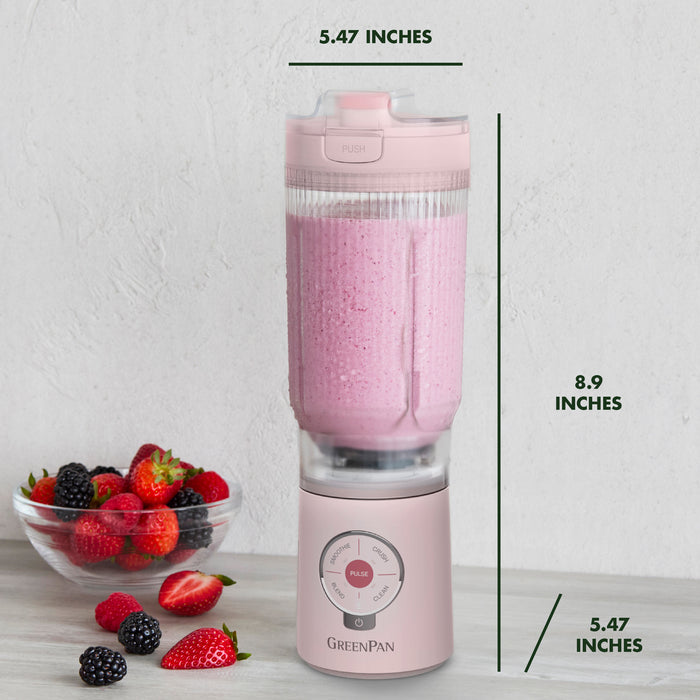 Pink portable blender with measurements on a white background