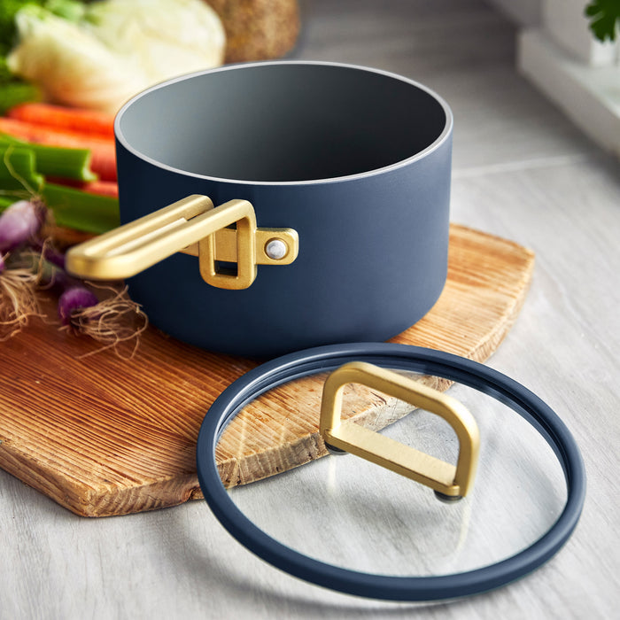 Ceramic nonstick mini cookware set, 3 pieces in Marino Blue, displayed on a cutting board with fresh vegetables nearby.