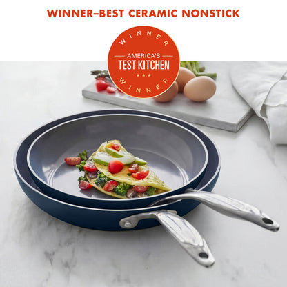 Ceramic nonstick frying pan with omelette on a marble surface, featuring America's Test Kitchen award.