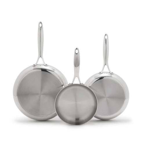 Three stainless steel frypans in 8, 9.5, and 11 sizes overlapping upright on a white background.