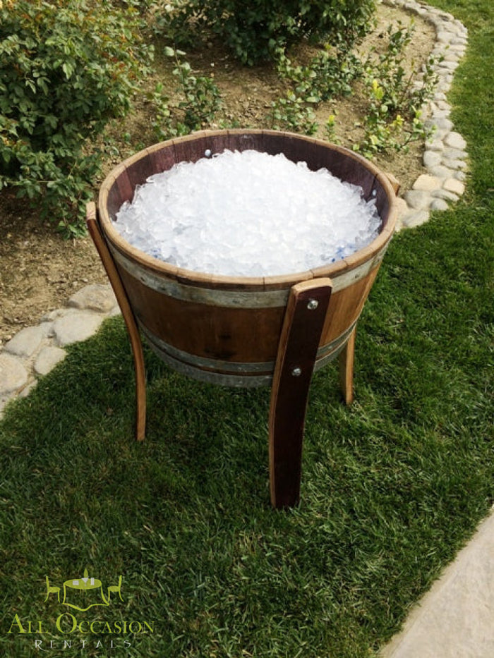 Wine barrel ice chest filled with ice for outdoor events, perfect for Corona party rentals and banquet table rentals.